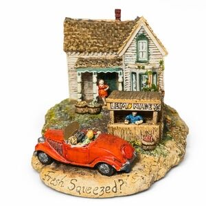 Charming Miniature House with Red Car